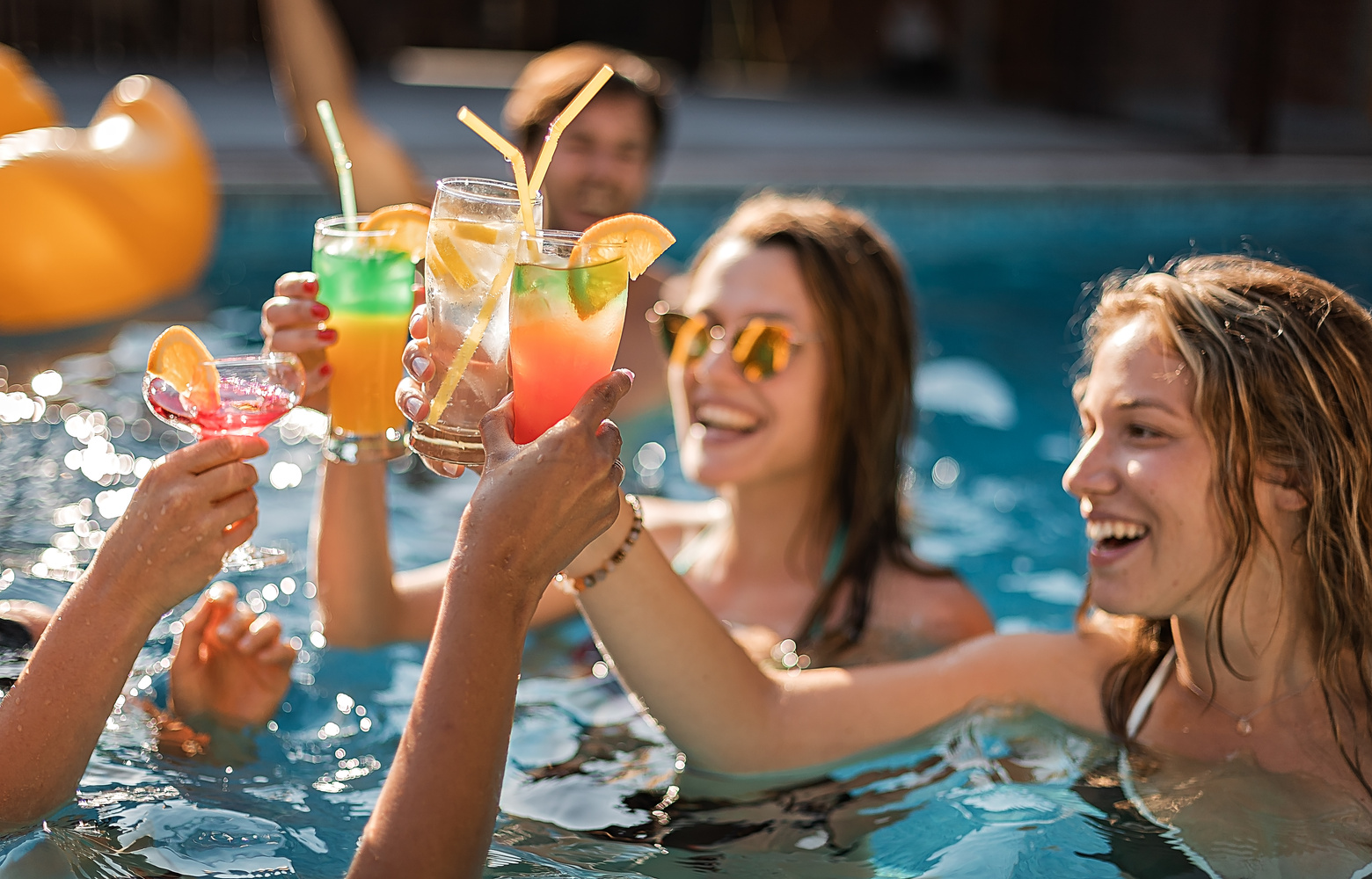 Happy friends having pool party